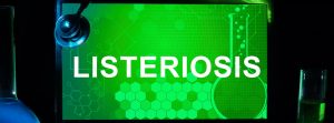 pantalla de ordenador con fondo verde y la palabra listeriosis