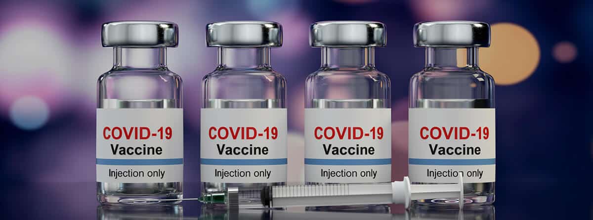 Vacunas frente el COVID-19: varios frasos de vacunas y una jeringuilla